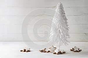 White wire christmas tree decoration and cinnamon star cookies a