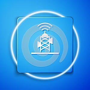 White Wireless antenna icon isolated on blue background. Technology and network signal radio antenna. Blue square button