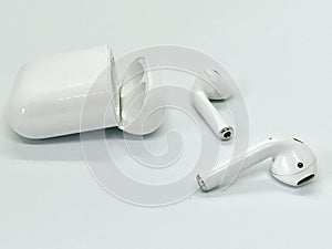 White Wireless Earbuds Out of Opened Case photo