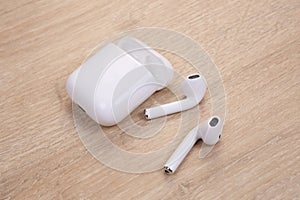 White wireless earphones with case