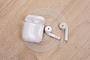 White wireless earphones with case