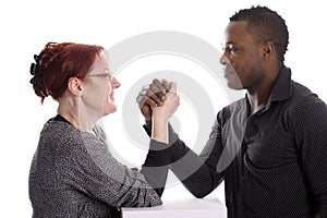 White woman and black man doing arm wrestling