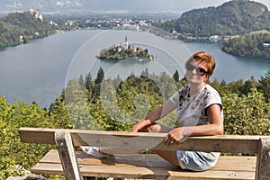 White woman and lake Bled view from above in Slovenia