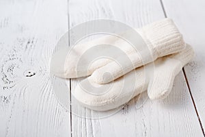 White women`s knitted mittens