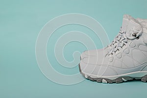 White women`s running shoes with fur for winter sports.