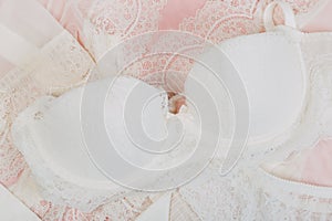 White women underwear with lace on pink background. whitebra and pantie.Copy space. Beauty, fashion blogger concept. Romantic