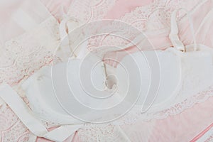 White women underwear with lace on pink background. whitebra and pantie.Copy space. Beauty, fashion blogger concept. Romantic