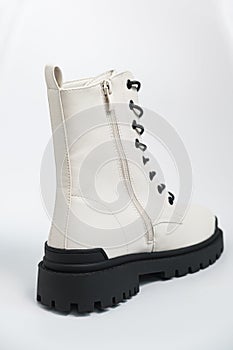 White womens autumn rough army boots on a tractor sole with laces, on white background