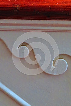 White wood staircase wave trim detail