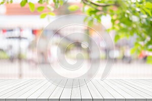 White wood table top on blurred background from garden, Space for montage your product