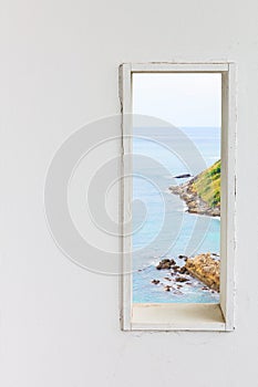 White wood wall window with sea beach view.