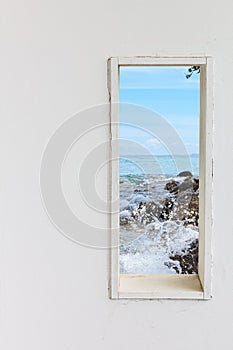 White wood wall window with sea beach view.