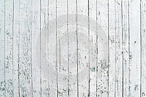 White wooden background. Old shabby wood planks. A stripped white fence. Natural creative texture for editing and design