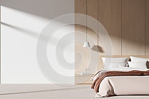 White and wooden bedroom interior with blank wall