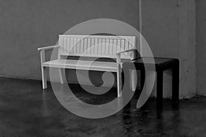 White wooden bench and black wooden table