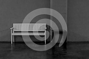 White wooden bench and black wooden table