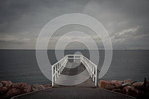 White wooden bridge in ocean