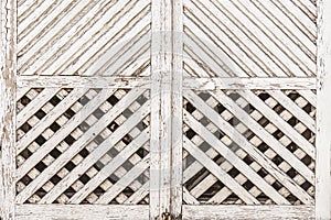 White wooden carved frame, window shutters of old village house close-up