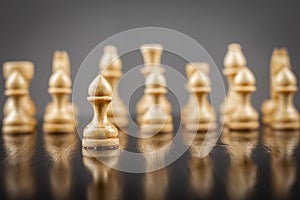 White wooden chess pieces. Focus on pawns. Reflection. Strategy. Game. Sport. Business