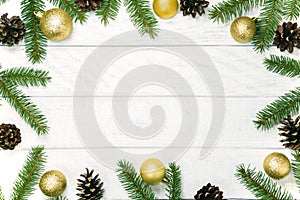 White wooden Christmas background. Border decorated fir branches