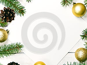 White wooden Christmas background. Border decorated fir branches and pin cones. Copy space for holiday greetings. lovely