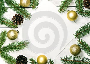 White wooden Christmas background. Border decorated fir branches