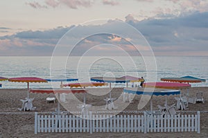 White wooden fence on beach foreground