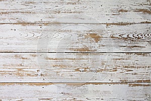 White wooden floorboards. Distressed worn floorboard background painted white