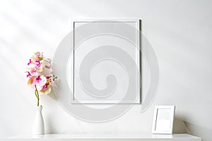 White wooden frame on white wall above the table copy space