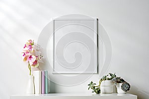 White wooden frame on white wall above the table copy space