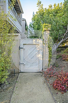 White wooden gate entry way to houses in Del Mar Southern California