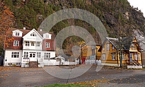 White wooden House in Autumn colours in Valldal n Norway