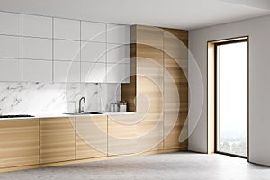 White and wooden kitchen corner with cupboards