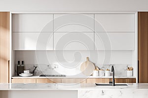 White and wooden kitchen with cupboards, close up