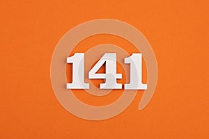 White wooden number 141 on eva rubber orange background
