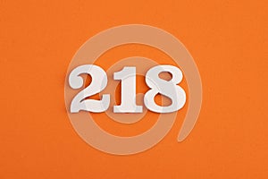 Number 218 - On orange foam rubber background