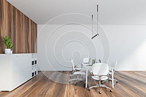 White wooden office room with shelf for folders, white chairs and table