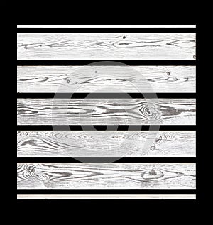 White wooden planks isolated on black background. Light rustic wood texture background.