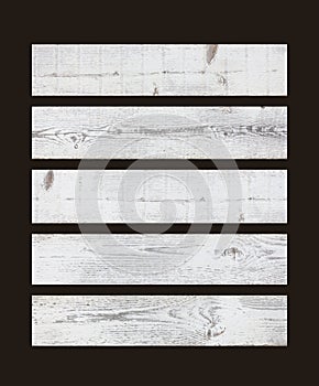 White wooden planks isolated on black background. Light rustic wood texture background.