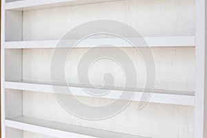 White Wooden Shelf on a Wall in Light Room