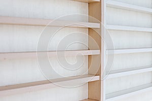 White Wooden Shelf on a Wall in Light Room