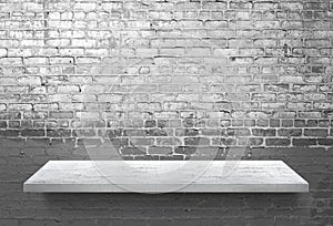 White wooden shelf on white brick wall