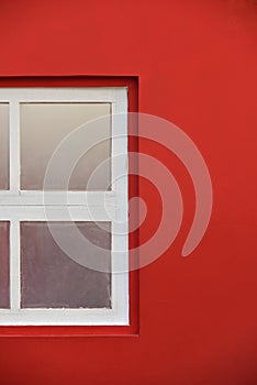White Wooden Window With Glass Pane In Red Wall