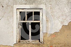 White wooden window in the old house with broken glass
