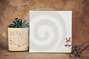 White wrapped canvas on stretcher and decorative art background. Mockup picture.