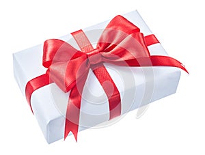 White wrapped present box with red ribbon isolated on white