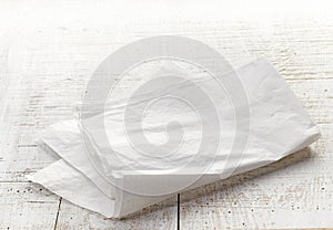 White wrapping paper on wooden table