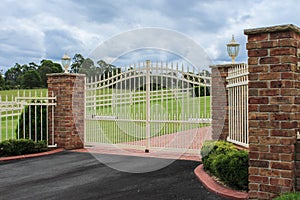 White wrought iron driveway entrance gates