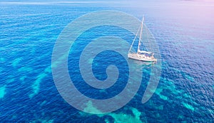 White yacht coral reef in Beautiful bay sea. Aerial top view