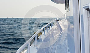 The white yacht deck during sailing on a beautiful blue sea